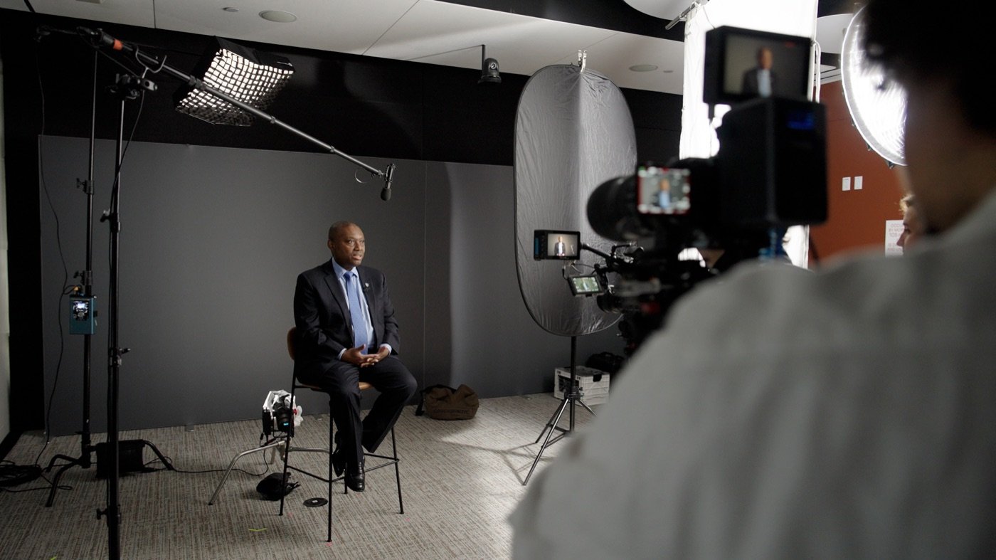 Behind-the-scenes view of Film Label’s cameras, lighting and sound setup for executive interviews.